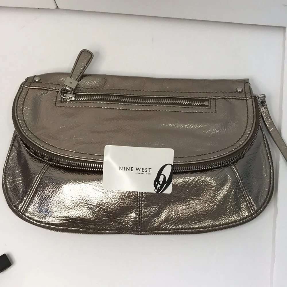 Price is firm NINE WEST Metallic Silver Zip Magnet Fold Clutch